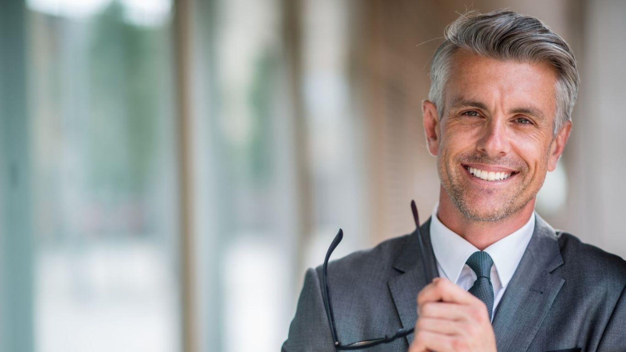 man smiling, because he got a caveat loan