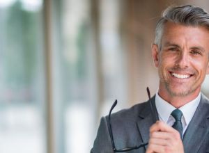 man smiling, because he got a caveat loan