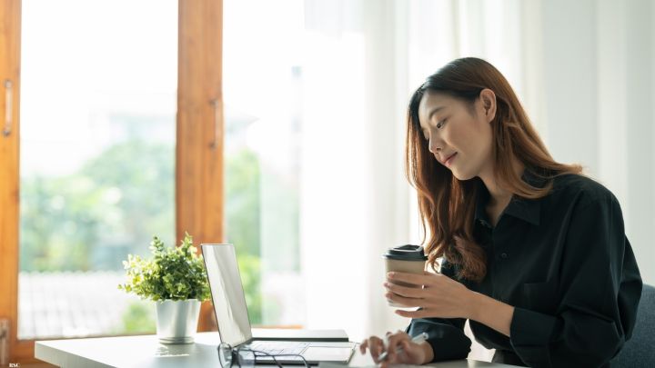 Lady looking at invoices 1